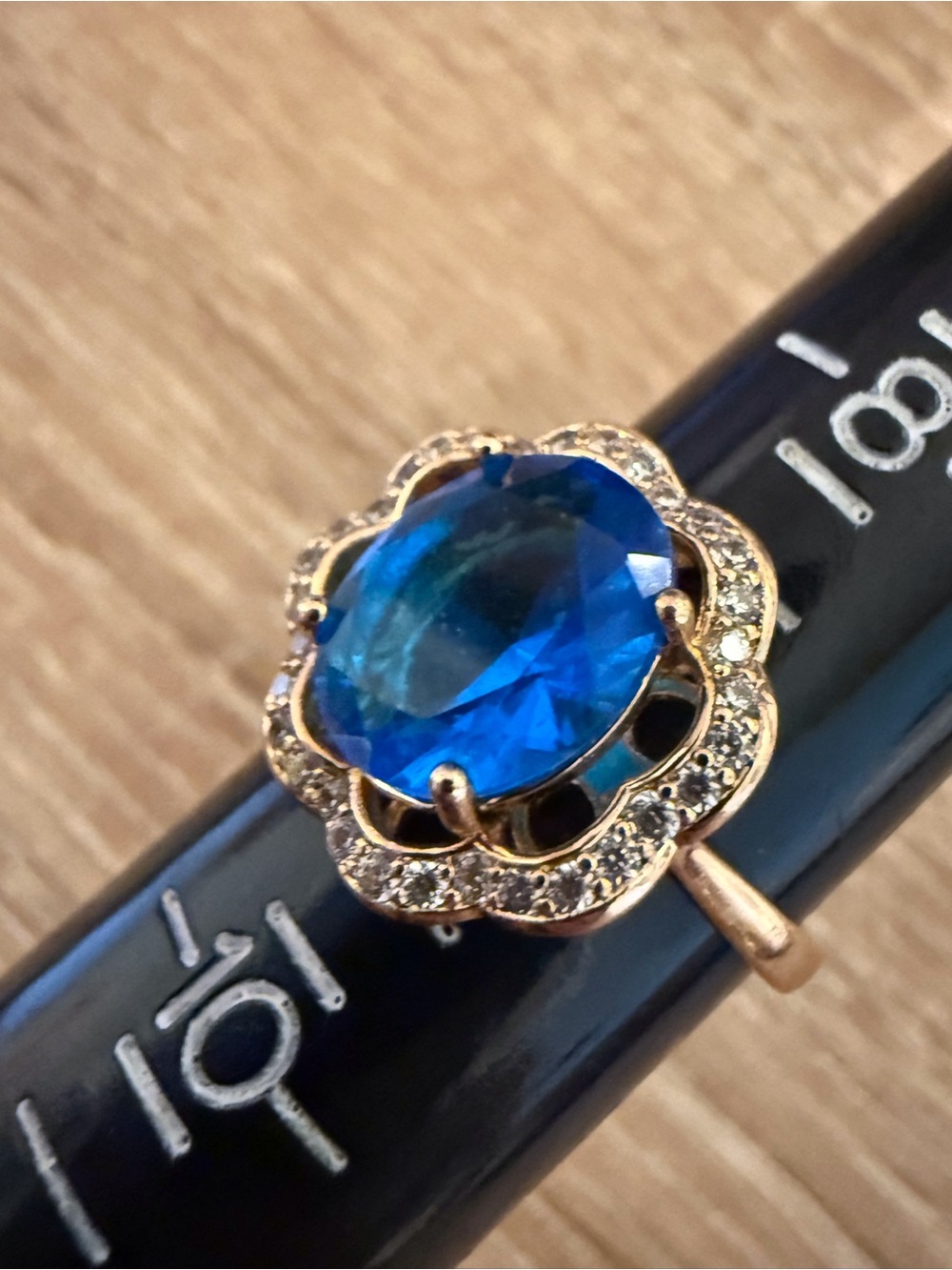 Gold Flower Ring with Blue Oval Center Stone